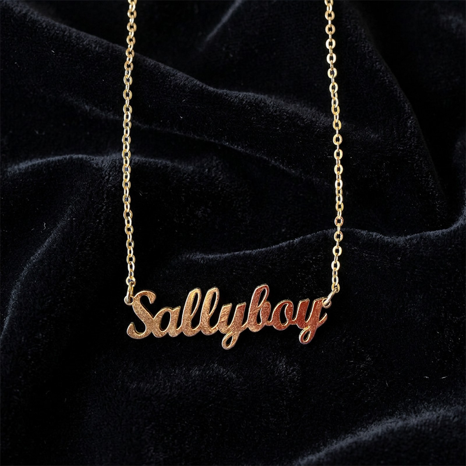 after: jewelry photo of the same gold name necklace on black velvet
