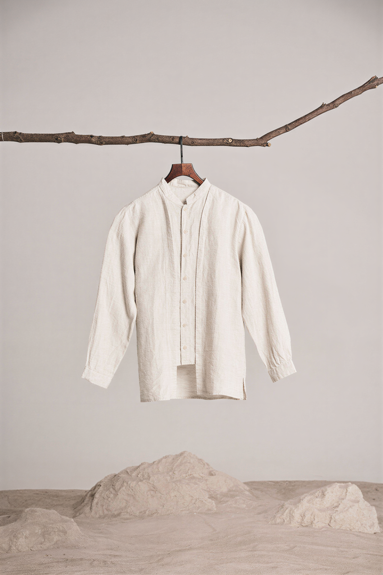 after: AI-enhanced detail on beige shirt seams, buttons and fabric folds