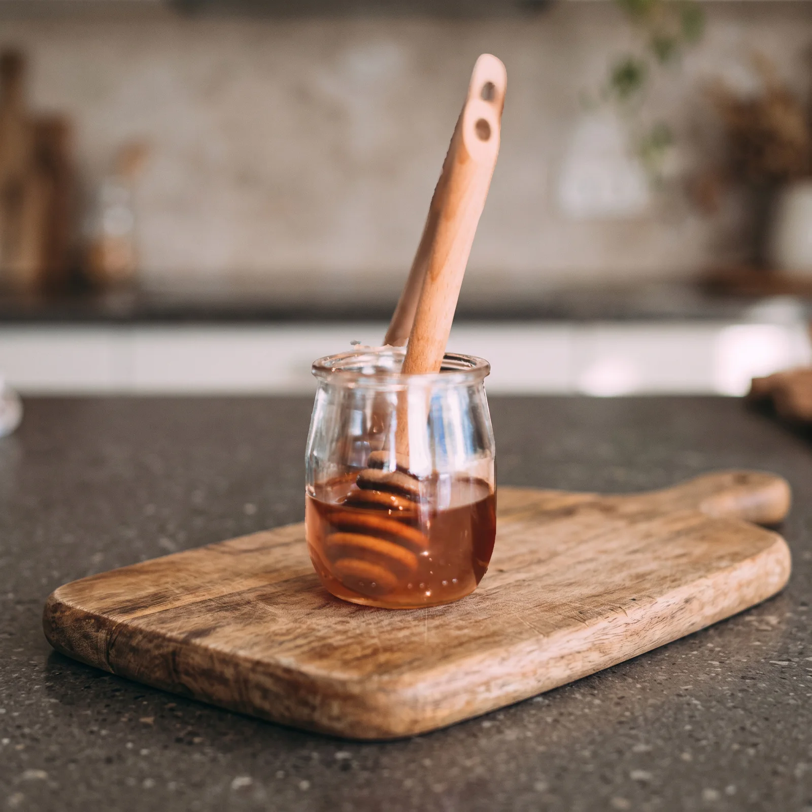 after: the same unbranded honey jar on a wooden board