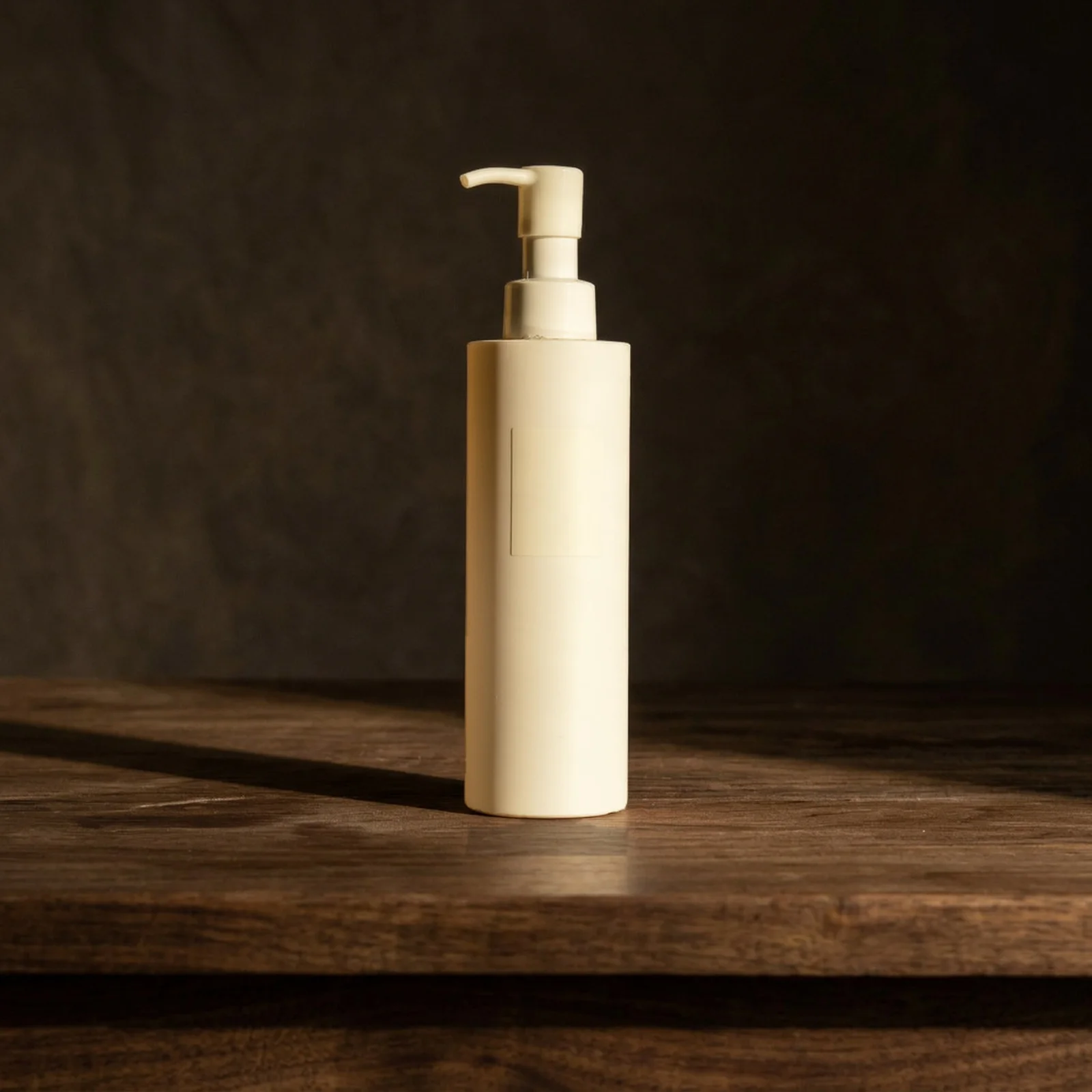 unbranded pump bottle on warm wood
