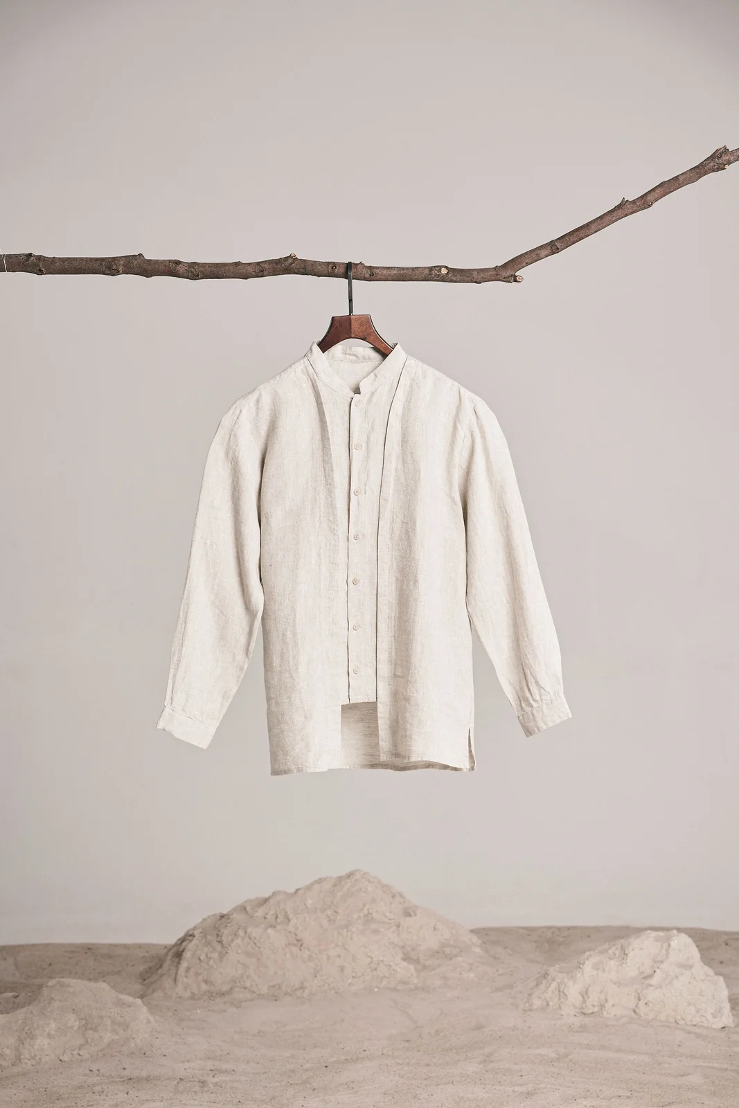 before: unbranded ivory shirt on a branch and hanger
